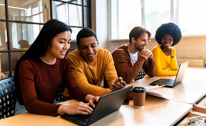 Students gathered around laptop