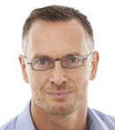 Acceptable Photo: Only head and shoulders are in the photo. Squarely facing the camera. Facial features are clearly visible with no shadows or obstructions.