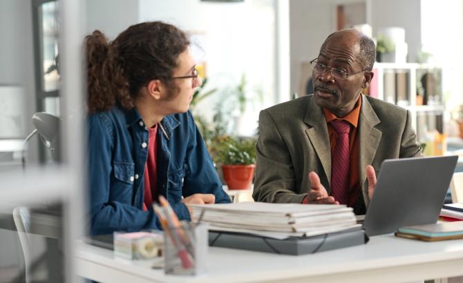 An academic support professional advises a student